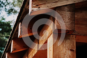 Closeup shot of wooden roof sheathing (roof overhang) on a blurred background