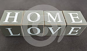 Closeup shot of words love and home written on wooden bricks