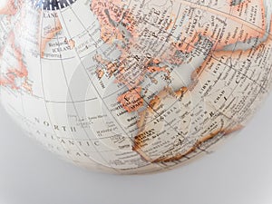 Closeup shot of the world map on a white surface