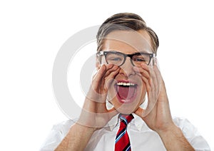 Closeup shot of a young man shouting loud