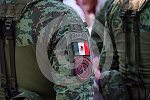 Closeup of the shoulder patches of Mexican soldiers during a civic ceremony on Mexico& x27;s flag day