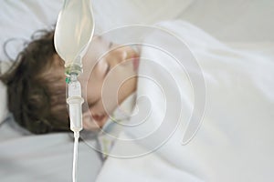 Closeup sick child sleep on hospital bed textured background with copy space