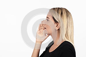 Closeup side view profile portrait woman talking with sound coming out of her open mouth isolated white background.