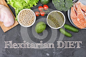 Closeup of a signboard with the text flexitarian on a pile of some different raw vegetables, such as cauliflower of