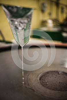 Closeup of Silica Sanding Table Spinning and water drooping photo