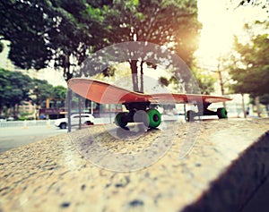 Closeup of skateboard at city skatepark