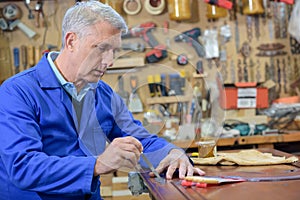 Closeup skilled carpenter working with wood