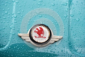 Closeup of Skoda logo on a Czech blue vintage car