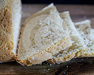 Closeup on sliced bread on wooden table