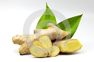 Closeup sliced Ginger with ginger root and green leaves Isolated on white background