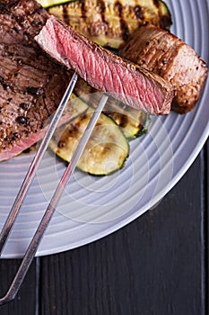 Closeup sliced medium rare grilled steak