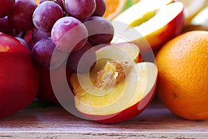 Closeup of sliced peach and grapes