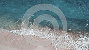 Closeup slow motion waving sea at sand beach aerial. Summer nobody nature seascape. Natural beauty