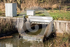 Small stainless steel weir in a stream