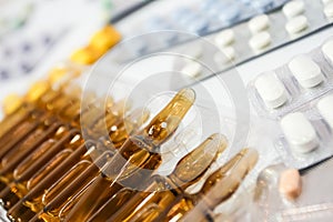 Small bottle of dose with pills pack photo