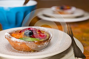 Closeup of a small fruit tart on a plate