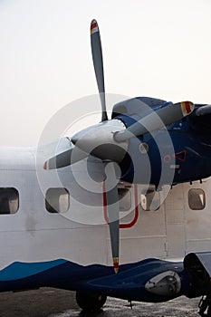 Closeup of small propeller aircraft in Kathmandu airport, Nepal