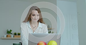 Closeup smiling business woman talking mobile phone at home office. Portrait of joyful girl making phone call at remote