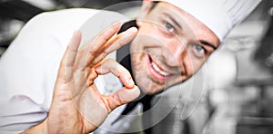 Closeup of a smiling male cook gesturing okay sign