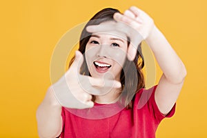 Closeup of Smiling Woman Making Frame Gesture