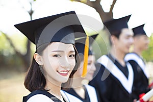 Closeup smiling young woman at graduation