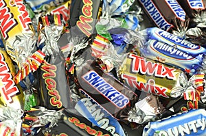 Closeup of Snickers, Mars, Bounty, Milky Way,Twix candies.