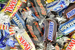 Closeup of Snickers, Mars, Bounty, Milky Way,Twix candies.