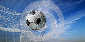 Closeup of soccer ball in goal net. Football play in front of blue sky background. Sport game championship background