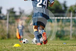 Closeup on Soccer Player Foot in Men`s Soccer Cleats. Footballers Shoes. Young Player Running photo