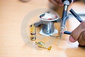 Closeup of soldering RCA cable, Repair and adjustment of the equipment
