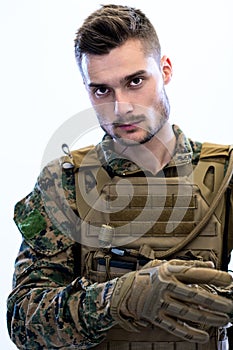 Closeup of soldier hands putting protective battle gloves