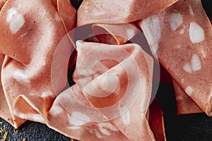 closeup of some slices of mortadella photo