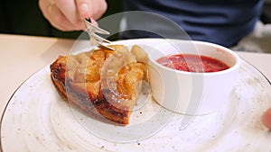 Closeup of someone eating a piece of apple pie with a fork