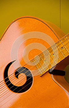 Closeup of soundboard and soundhole of a guitar