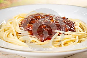 Closeup spaghtti red sauce in white plate. Italian food.