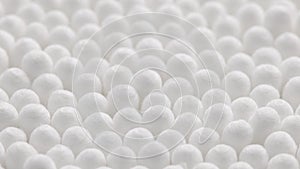 closeup spinning full-frame macro background of cotton earbud heads