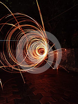 Closeup of spirally tangled light trails in the darkness of night