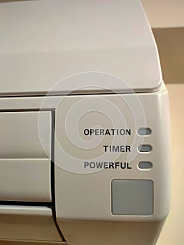 Closeup of split air conditioner on a white wall
