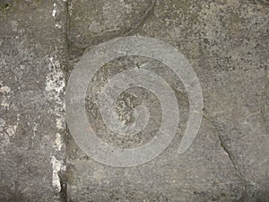 Closeup split, cracked layers of old masonry, limestone. facing plates in an architectural structure.