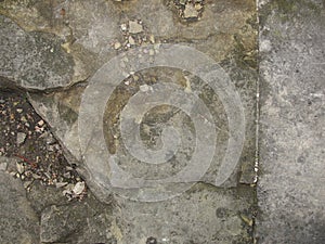 Closeup split, cracked layers of old masonry, limestone. facing plates in an architectural structure.