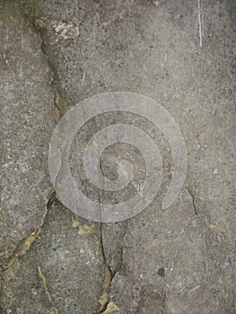 Closeup split, cracked layers of old masonry, limestone. facing plates in an architectural structure.