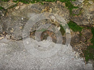 Closeup split, cracked layers of old masonry, limestone. facing plates in an architectural structure.