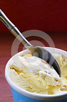 Spoon scooping delectable rum raisin ice cream photo