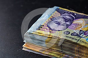Closeup of a stack of 100 LEI banknotes - world money, inflation and economy concept photo