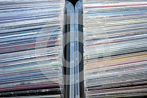 Closeup of stack of old vinyl records in covers