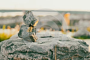 Closeup of stacked rocks in blurred background