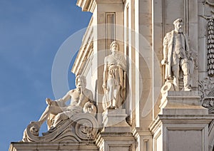 Closeup statues on the Arco Triunfal in the da Rua Augusta Praca do Comercio in Lisbon, the capital of Portugal. photo