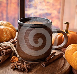 Steaming hot chocolate with autumn decorations photo