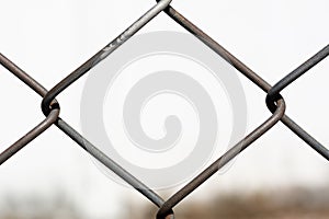 Closeup steel grating fence on nature light background