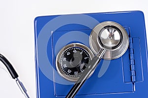 Closeup stethoscope and closed blue safe